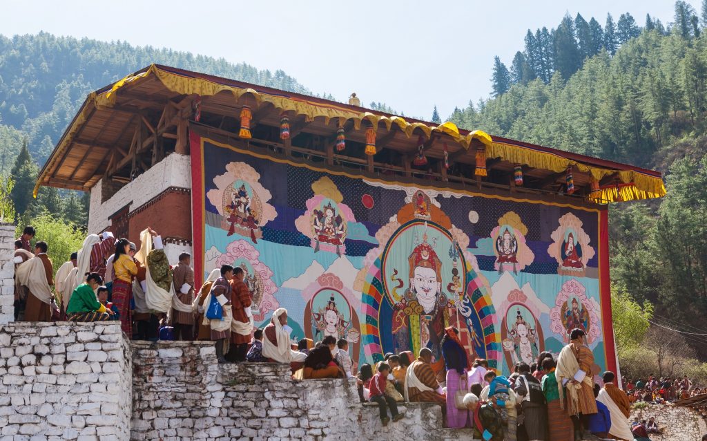 Paro,Bhutan-Apr 4,2015;Thongdroel(liberation on sight) of Guru Rinpoche hanging in Rinpung Dzong(fortress) during Paro Tshechu(festival) in order to confer blessings on Bhutanese assembled.